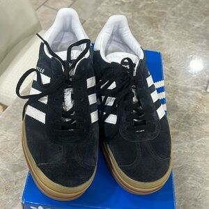 Brand new adidas gazelles size 7.5. Black and white. Perfect condition.